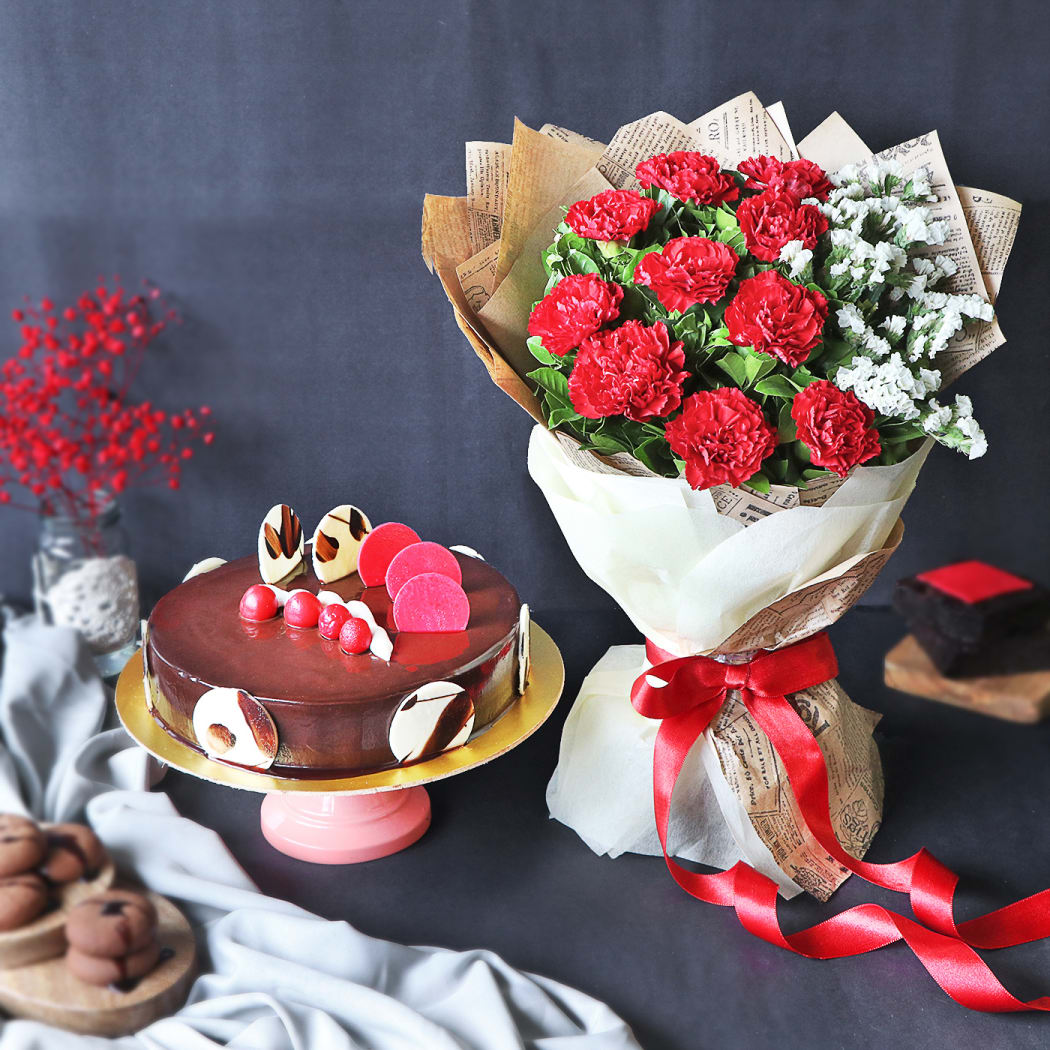 Elegant Truffle Cake With Bunch Of Red Carnations (Half kg) –  RainbowsnRibbons | Cake delivery in Jammu